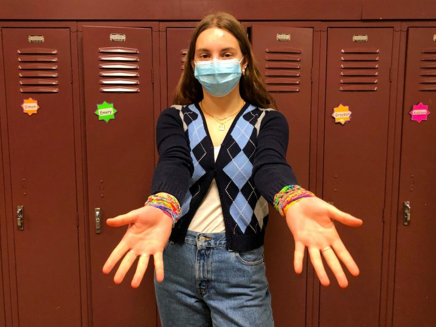 Margot Schneider ‘22, with wrists covered in Sillybandz and Rainbow Loom bracelets. Both jewelry items were popular during the time when Margot was in lower school.