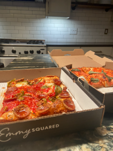 Emmy Squared’s “Roni Supreme” and Vodka sauce pizzas. When ordered, Emmy Squared pizza is delivered within an hour warm and fresh, as if it was ordered at the restaurant. 