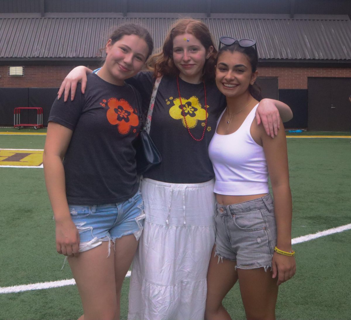 Lily Rosen '28, Emma McCahill '28, and Julia D'Amico '28 at the Spring Fair.