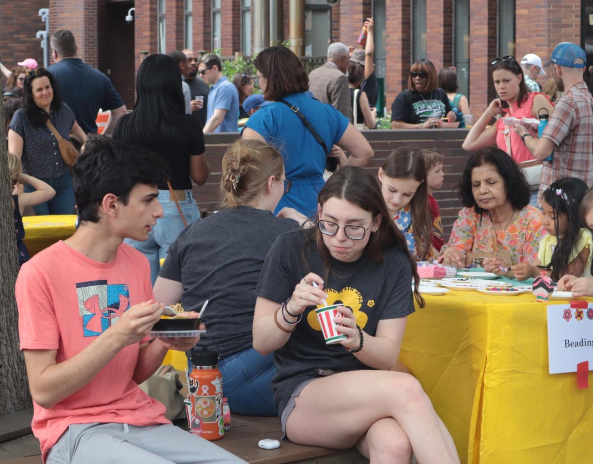 Families having fun in the back lot at the Spring Fair.