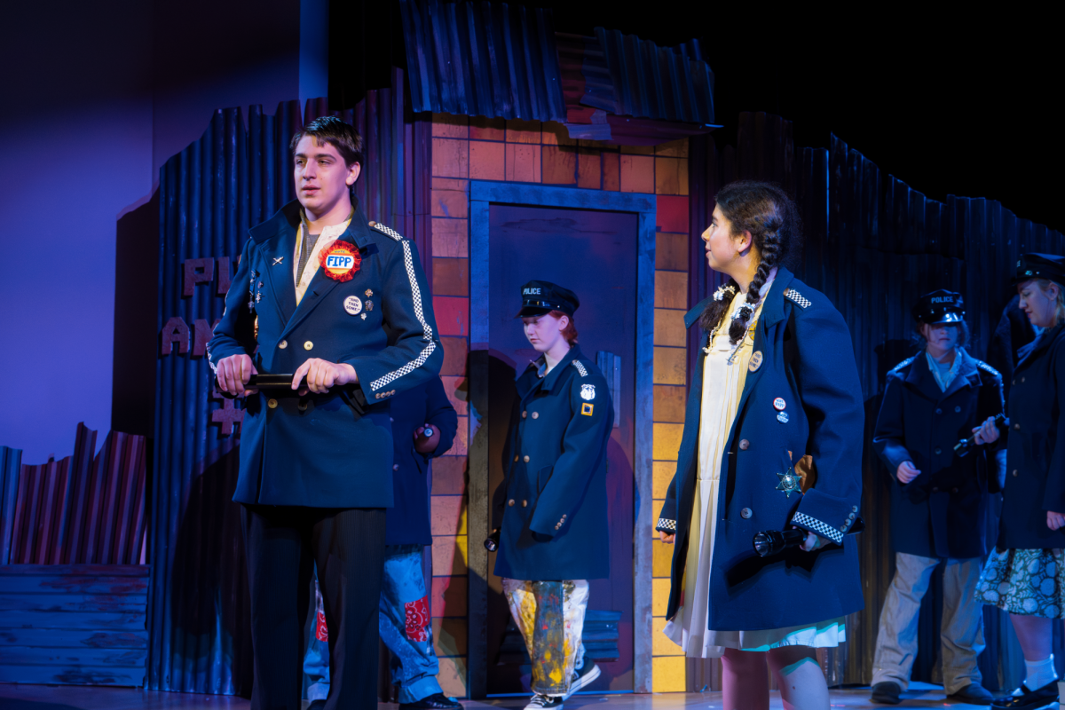 Sam Emerick ‘28 and Rachel Kadish ‘29 as Officer Lockstock and Officer Barrel