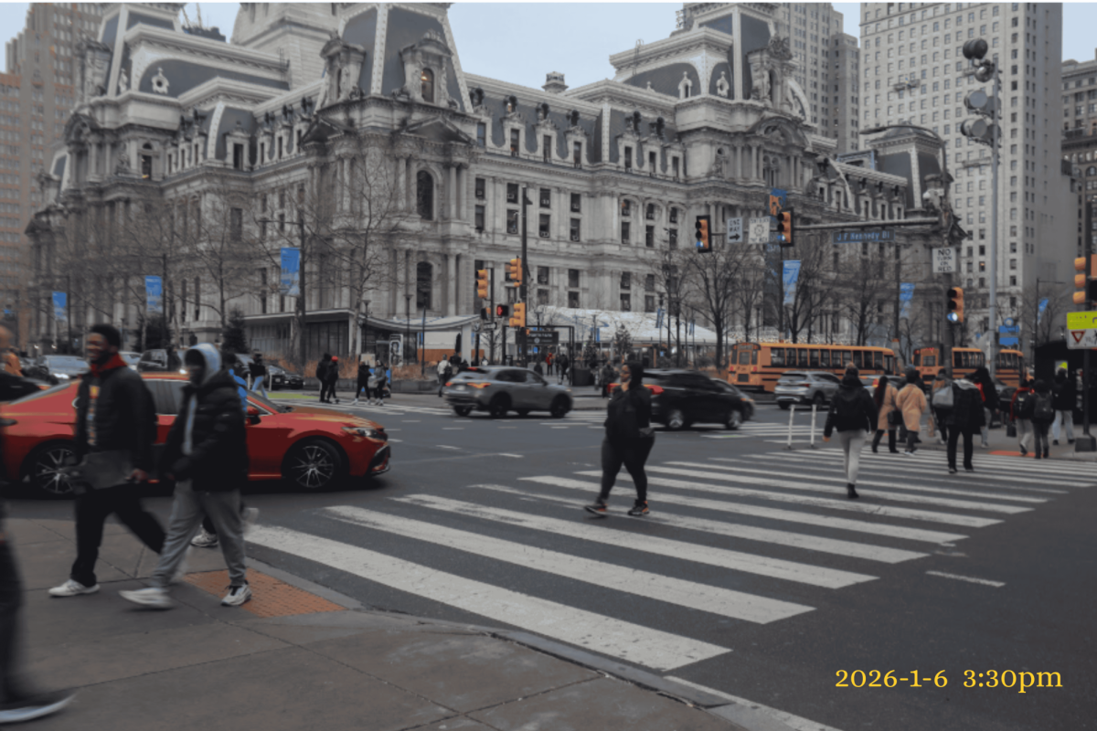 People cross a busy intersection at City Hall at 3:30pm. The area serves as a crossroad for all types of transportation. 