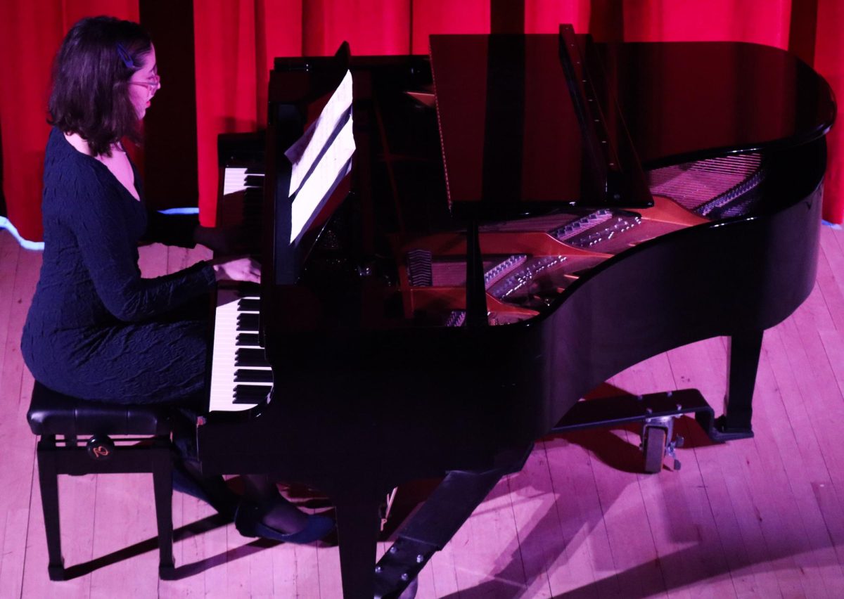Claire Serrani ‘28 playing “Somewhere Over the Rainbow” on the piano