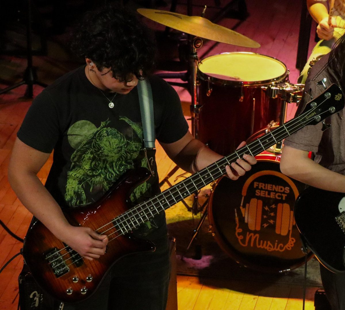 Fayola Kim ‘28 playing the bass on “While My Guitar Gently Weeps” by George Harrison